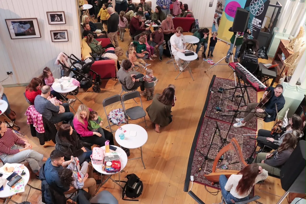 Families enjoying crafts and live music at The Duncairn’s Super Sunday gathering
